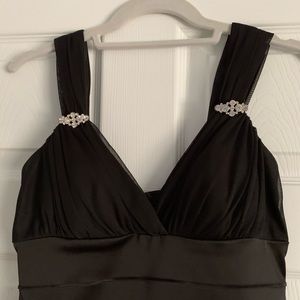 Black dress with rhinestones on the strapes. Size 4.